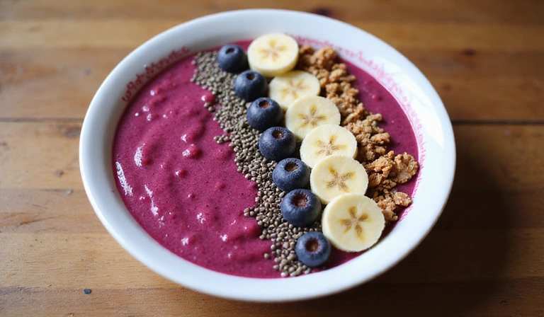 A vibrant smoothie bowl with various berries, nuts, and seeds, symbolizing energy-boosting foods.
